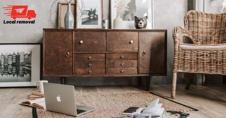 How to Move Heavy Furniture Without Damaging Your Floors or Walls 3 Removalist using furniture sliders to move a heavy sofa across a timber floor